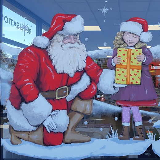 père noël réalisé en peinture sur vitrines commercess